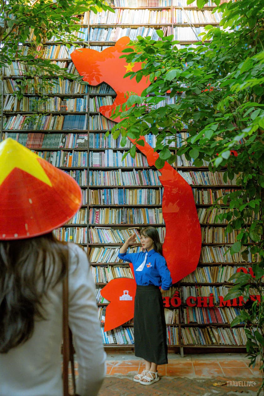 Old book wall with a giant red Vietnam map