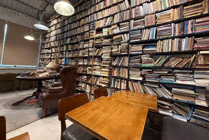 A quiet study nook by the yellowed book wall