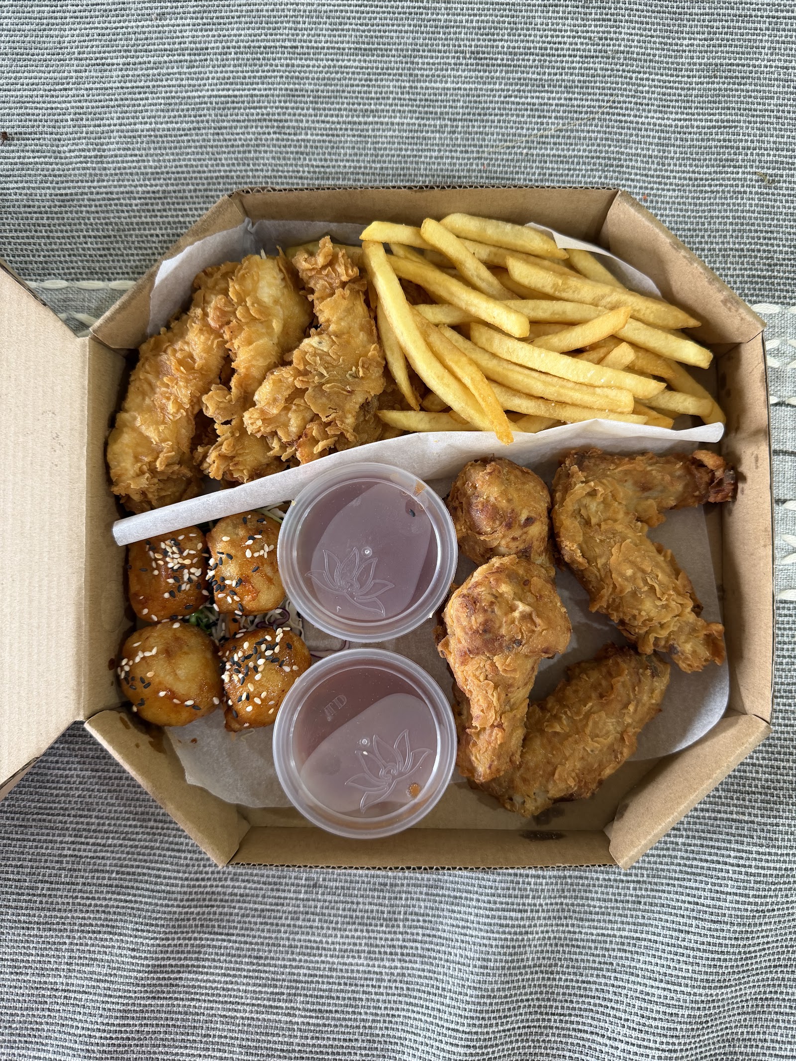 The chicken box — tenders, wings, fries