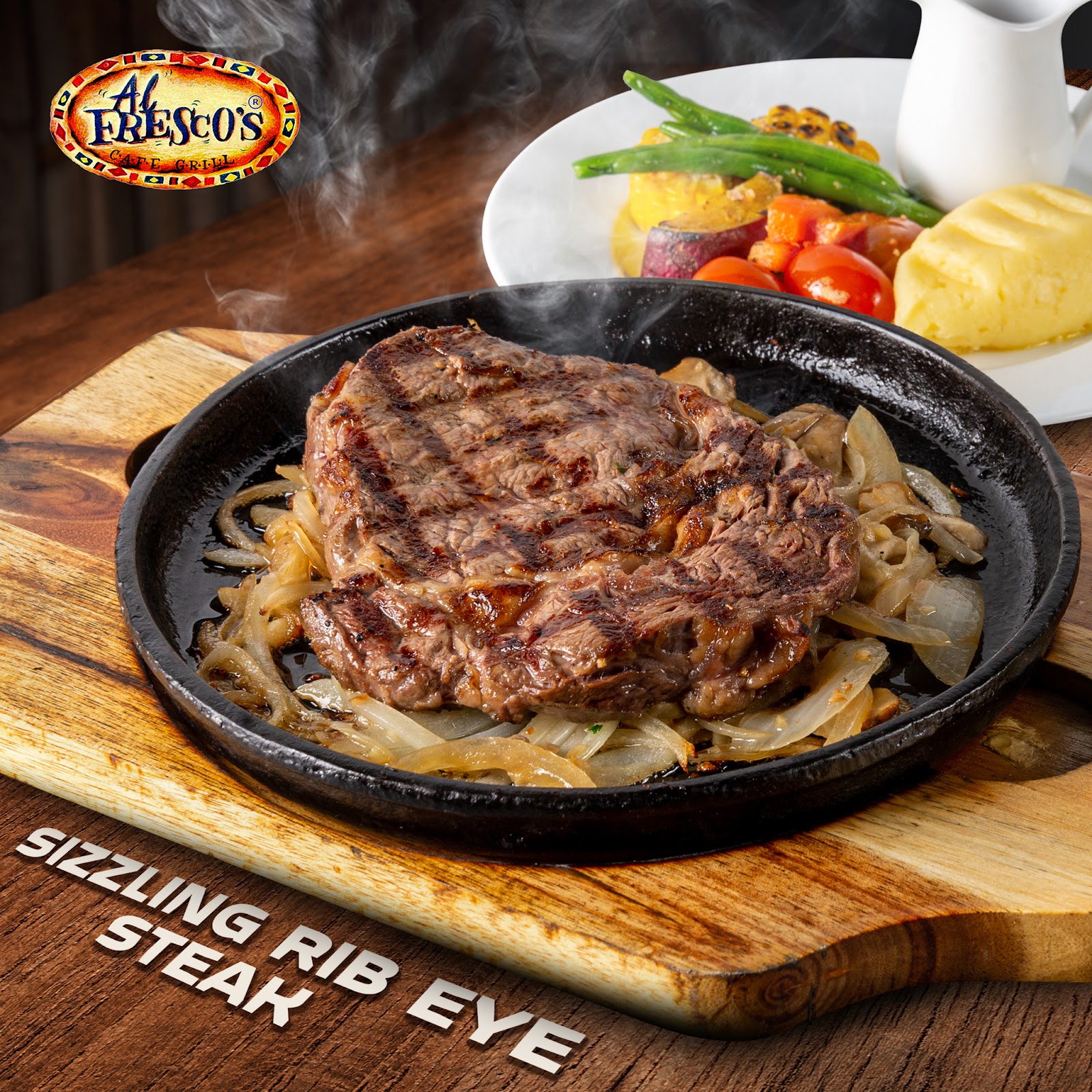 Sizzling rib eye on the iron plate
