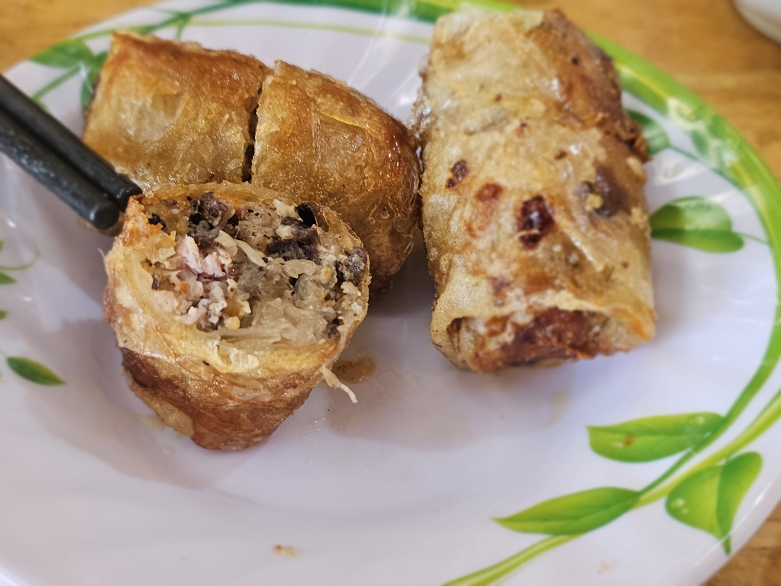 A crab spring roll cut open — the crab filling inside
