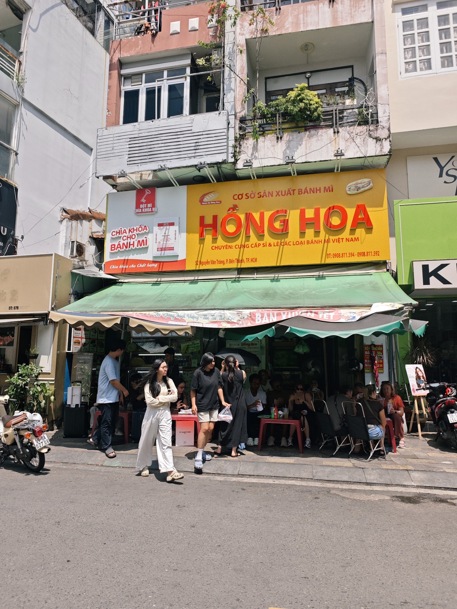 Full shophouse front — the yellow HỒNG HOA signboard