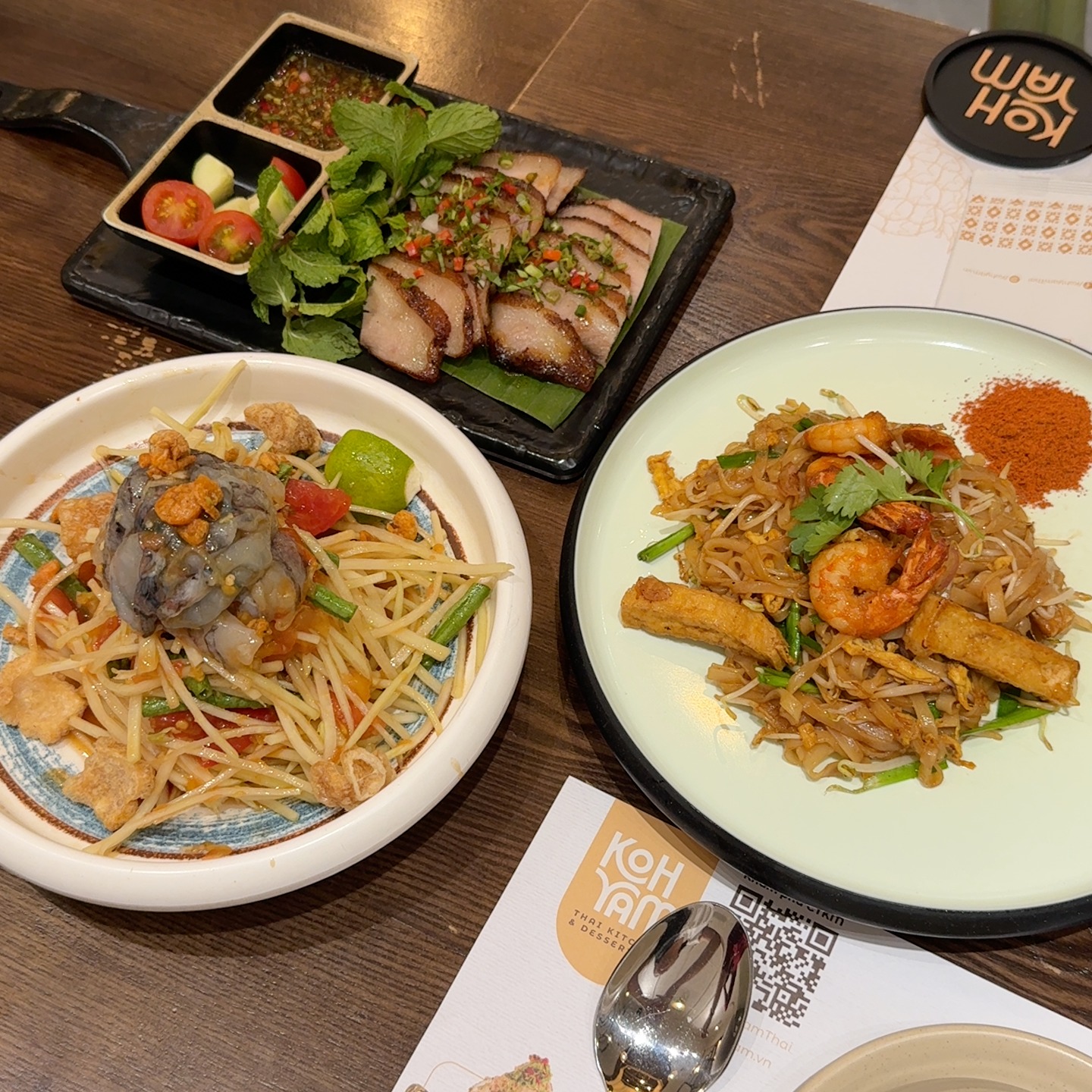 Koh Yam Thai spread: som tam, shrimp Pad Thai, sliced pork