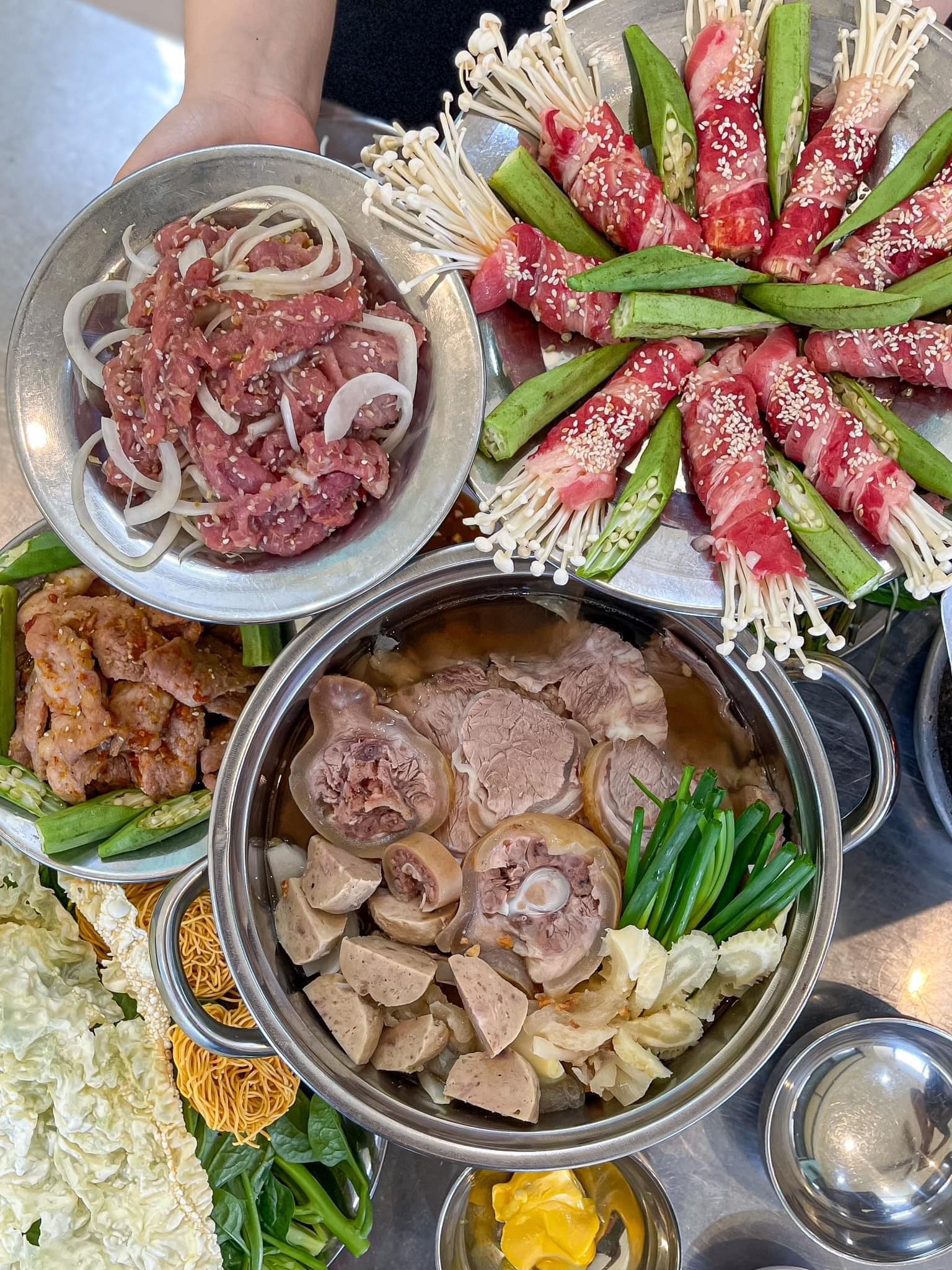 Marinated beef and pork sizzling on the fired clay tile