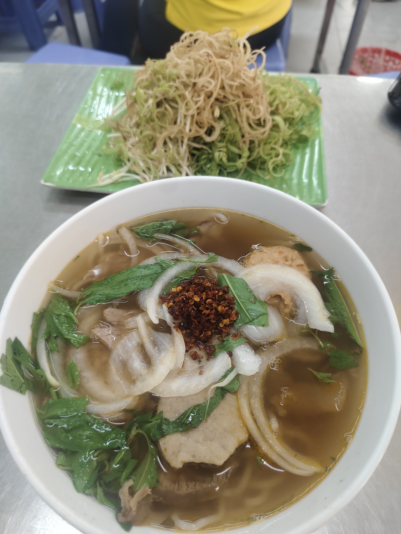 The crab-cake bun bo bowl — the red-smear cha cua (pending the venue photo pass)