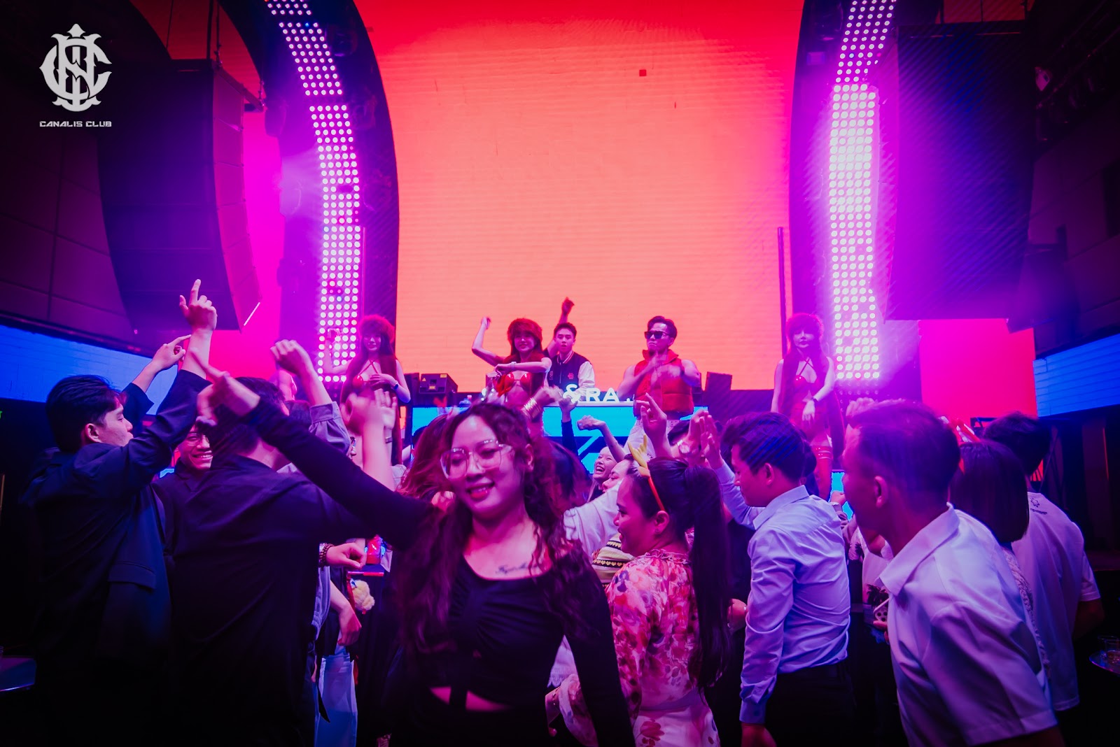 Canalis Club room at night — lasers and smoke