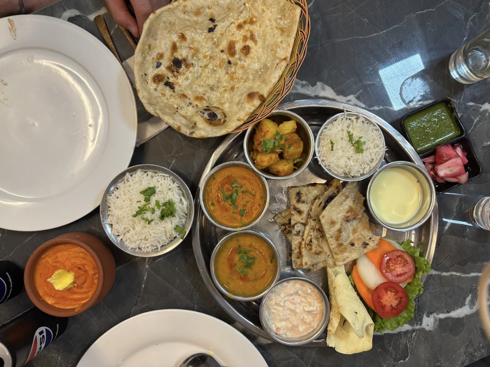 The full steel thali: dal, sabzi, potatoes, raita, rice