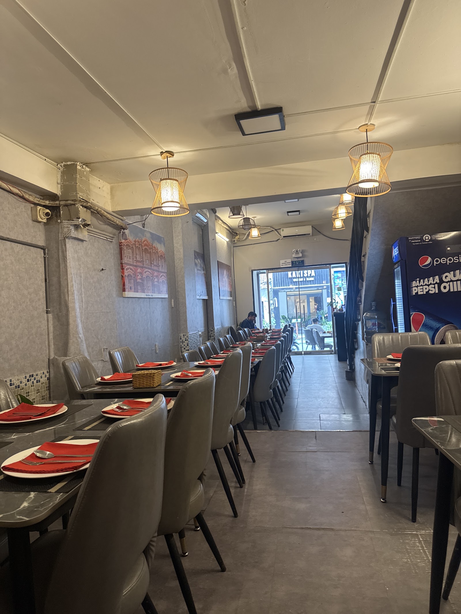 The Chandni Chowk dining room with rattan pendants