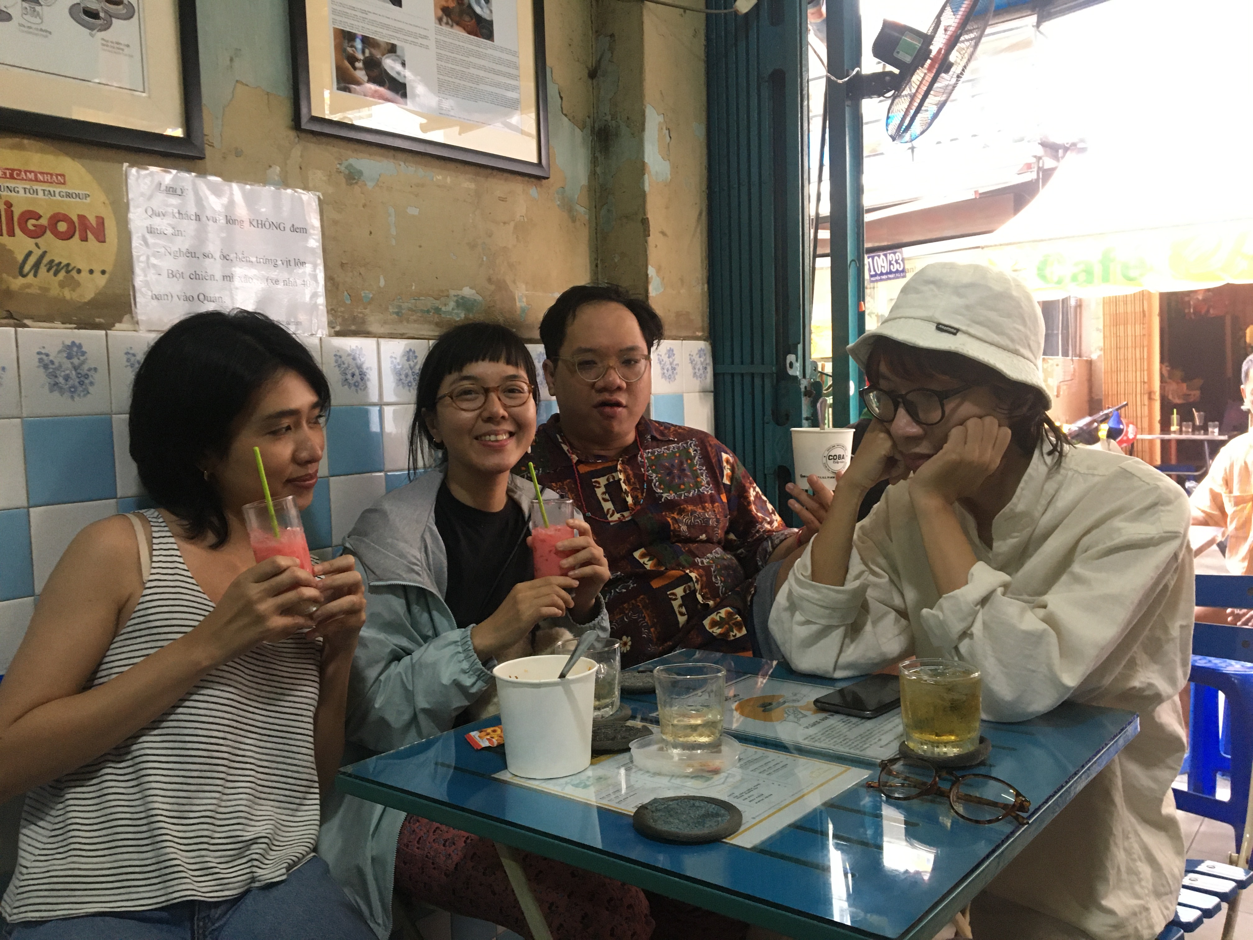 Customers drinking coffee at the shop