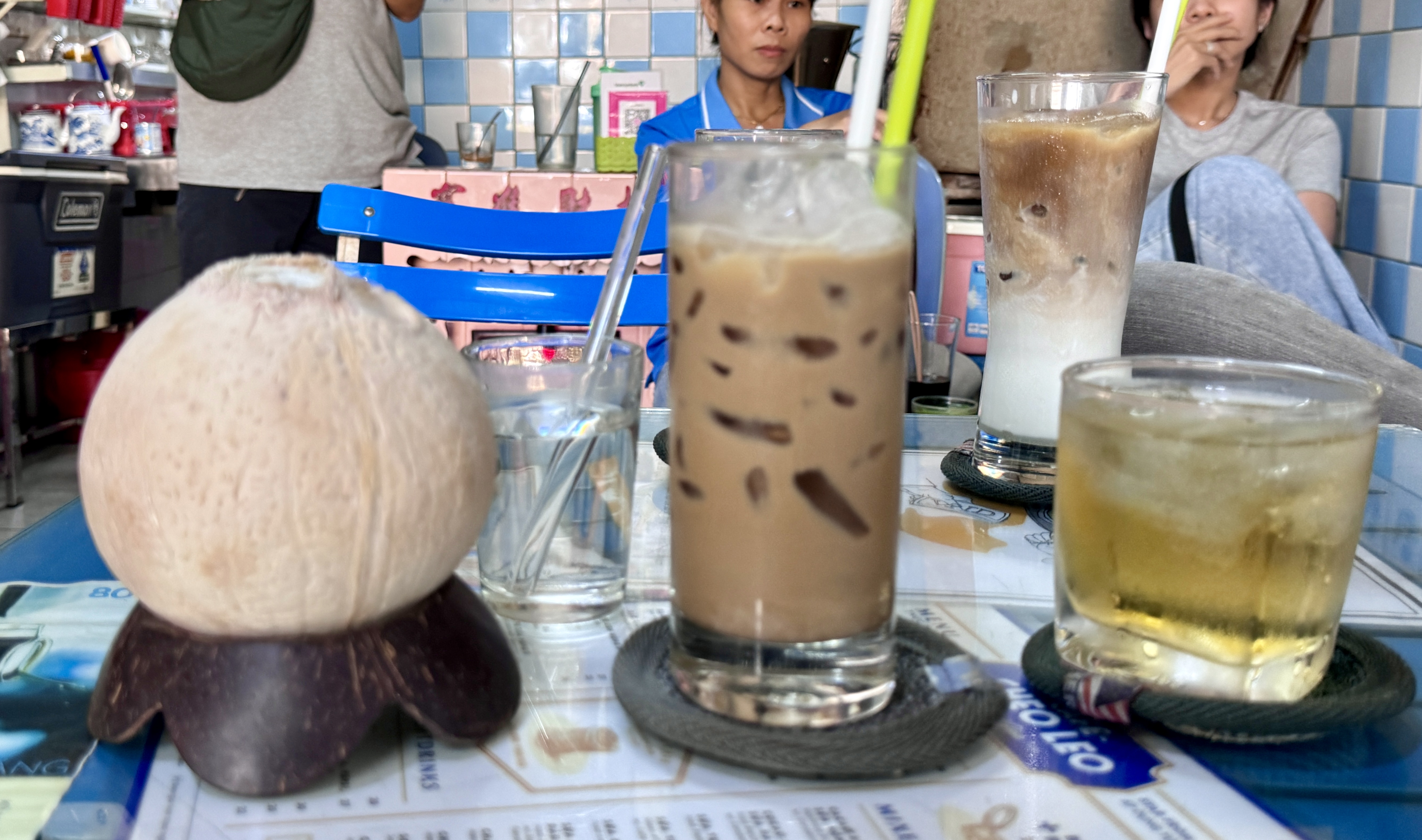 A coffee table full of drinks