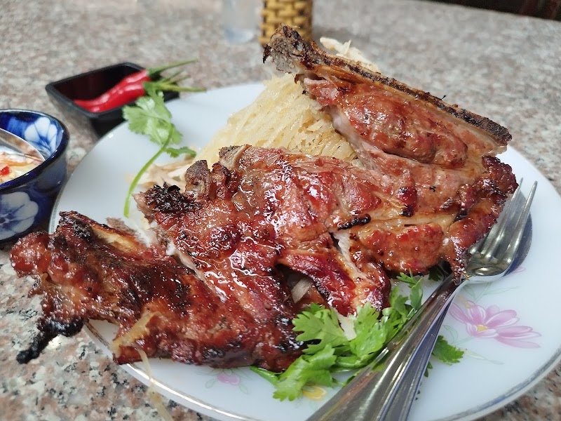 The giant charcoal slab chop — close up