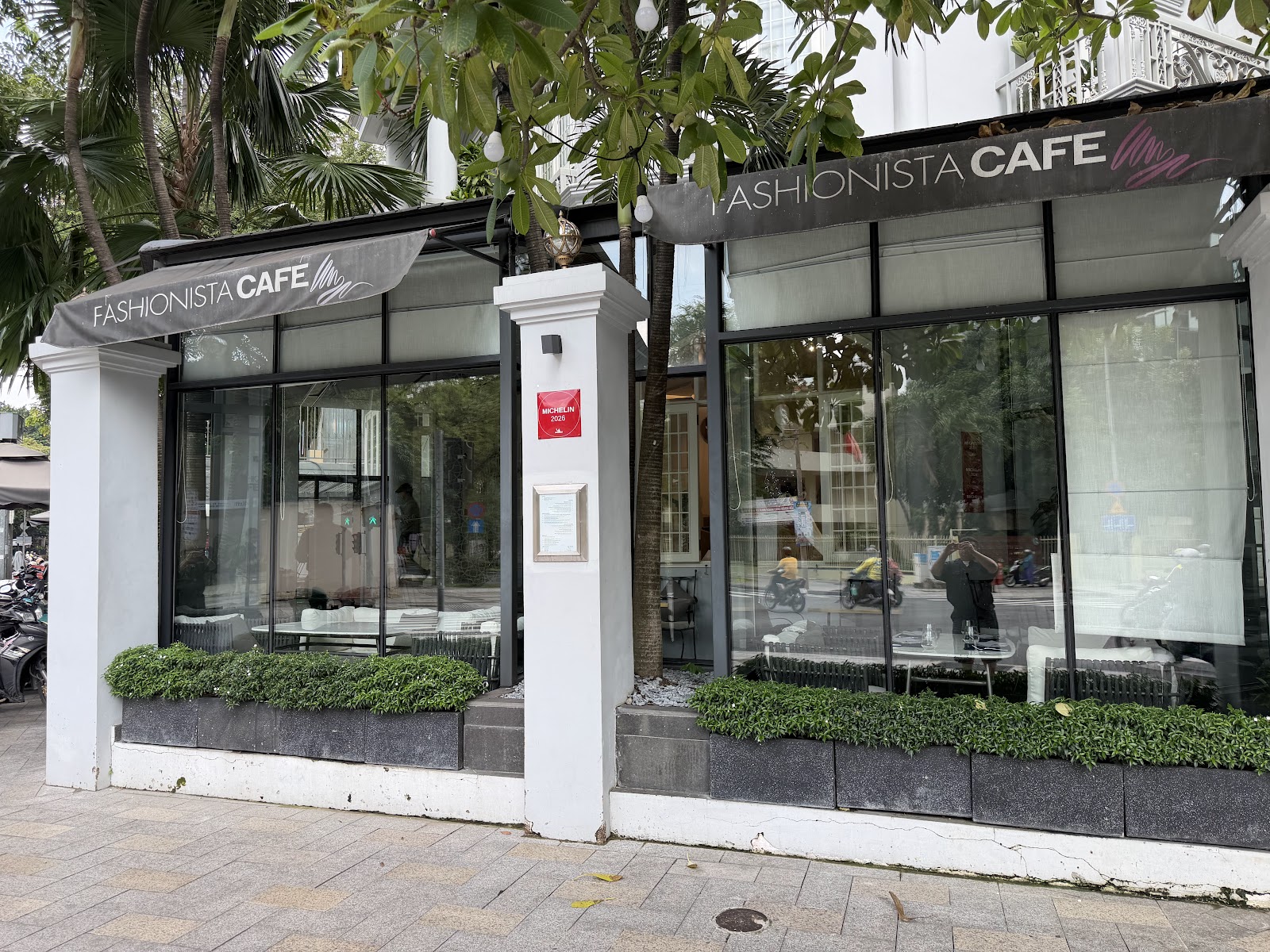 The Fashionista Café storefront with its red 2025 Michelin plaque
