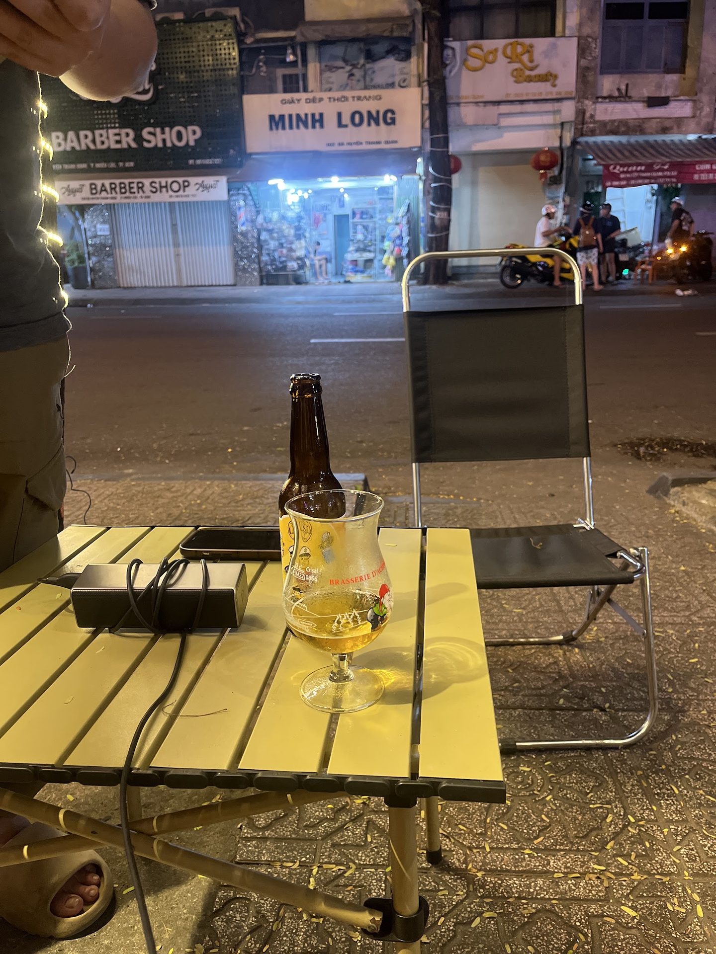 Sidewalk table with a fresh beer