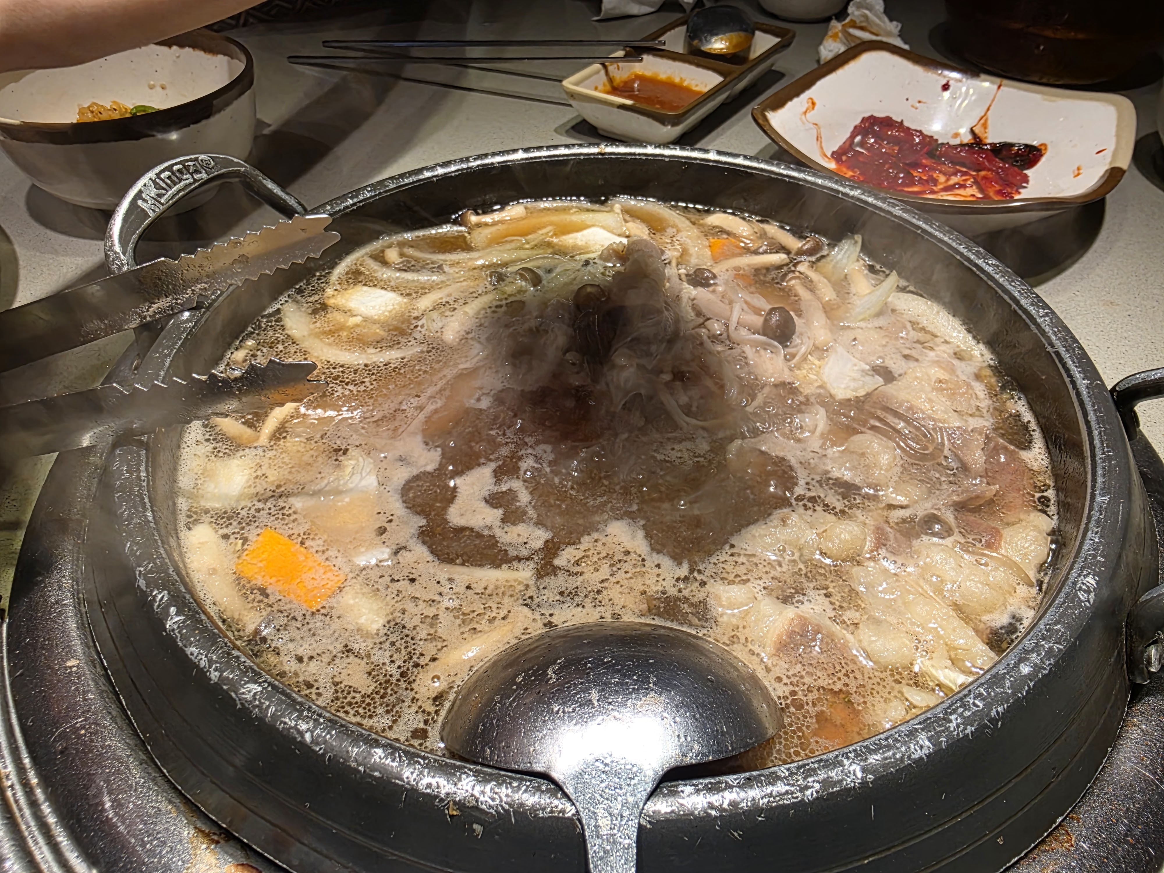 GoGi House Vincom Dong Khoi — the bubbling tabletop stone pot (Rick Vo, 05/2026)
