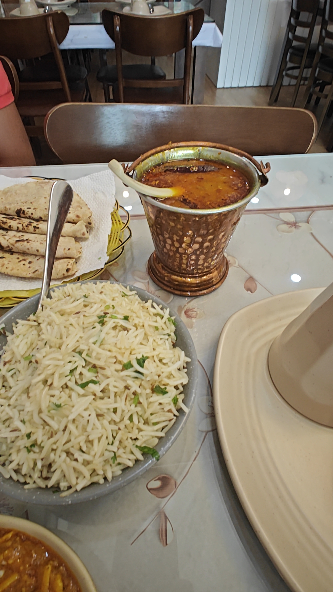 Dal served hot in the hammered-copper bucket