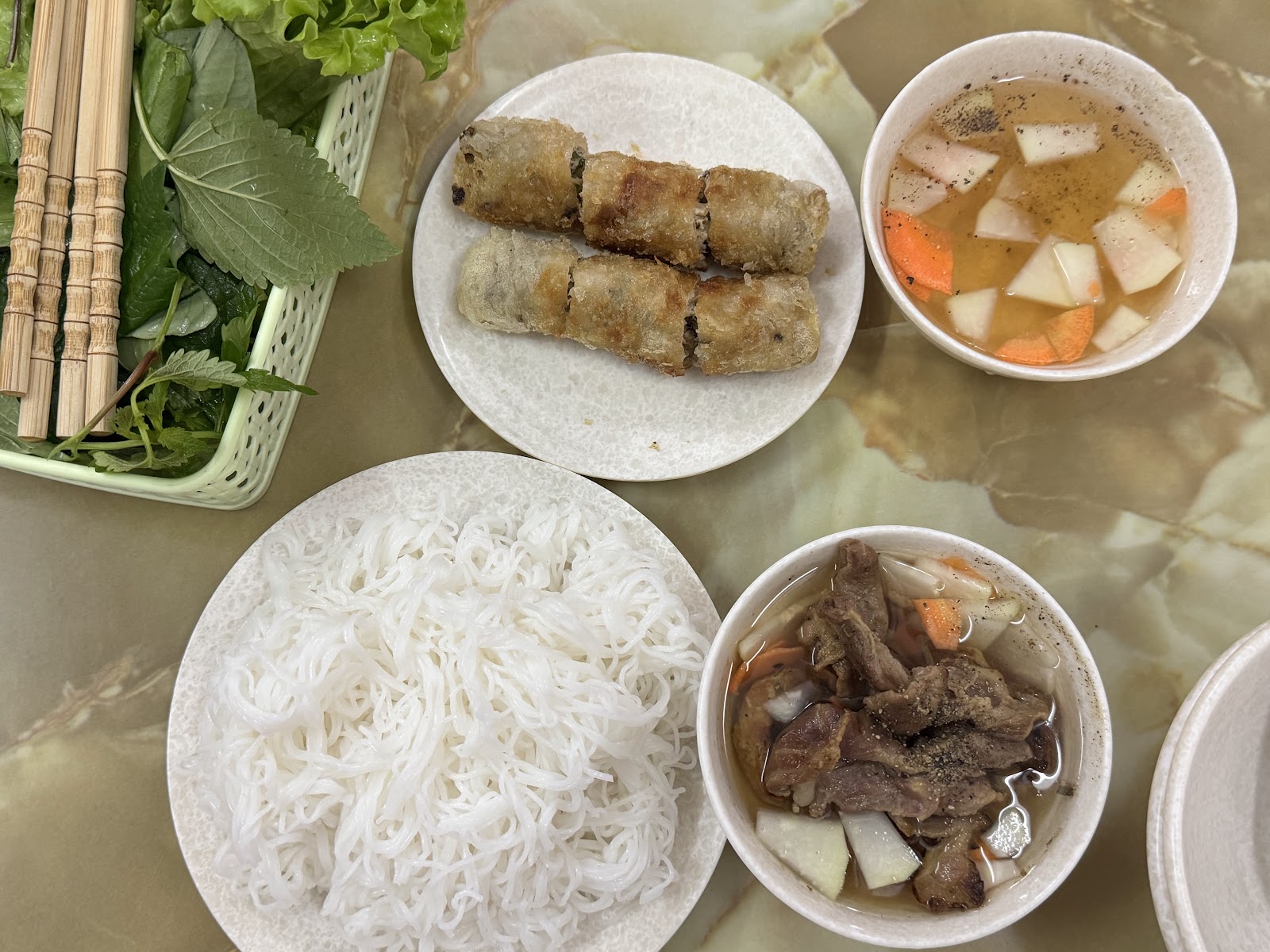 Sea-crab spring rolls — the plate of crisp fried rolls with white vermicelli, greens, pickles and the pork bowl