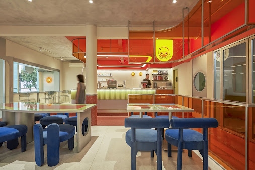 Orange ceiling and blue chairs