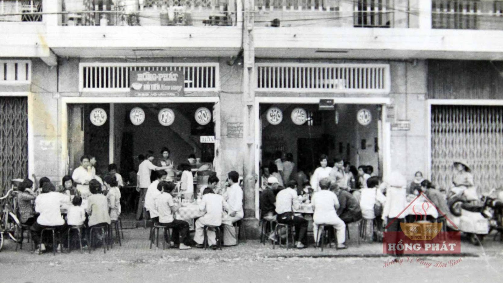 Black-and-white photo of the early Hong Phat shopfront
