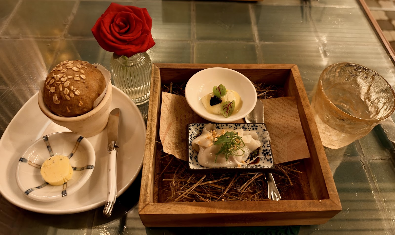Bread service and amuse-bouche with a red rose