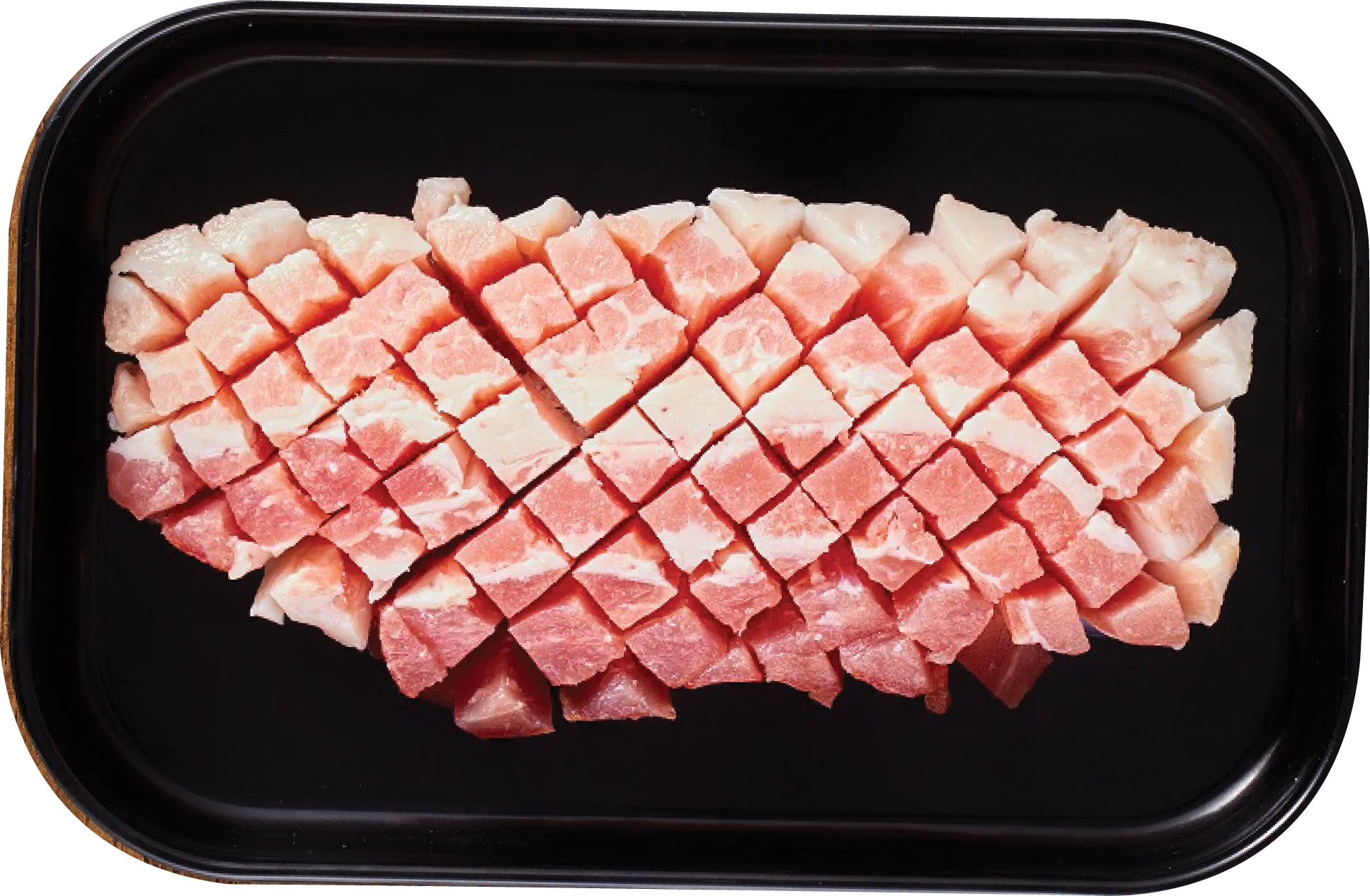 Honeycomb-cut pork belly with crosshatch scoring on a black tray — the venue's menu photo