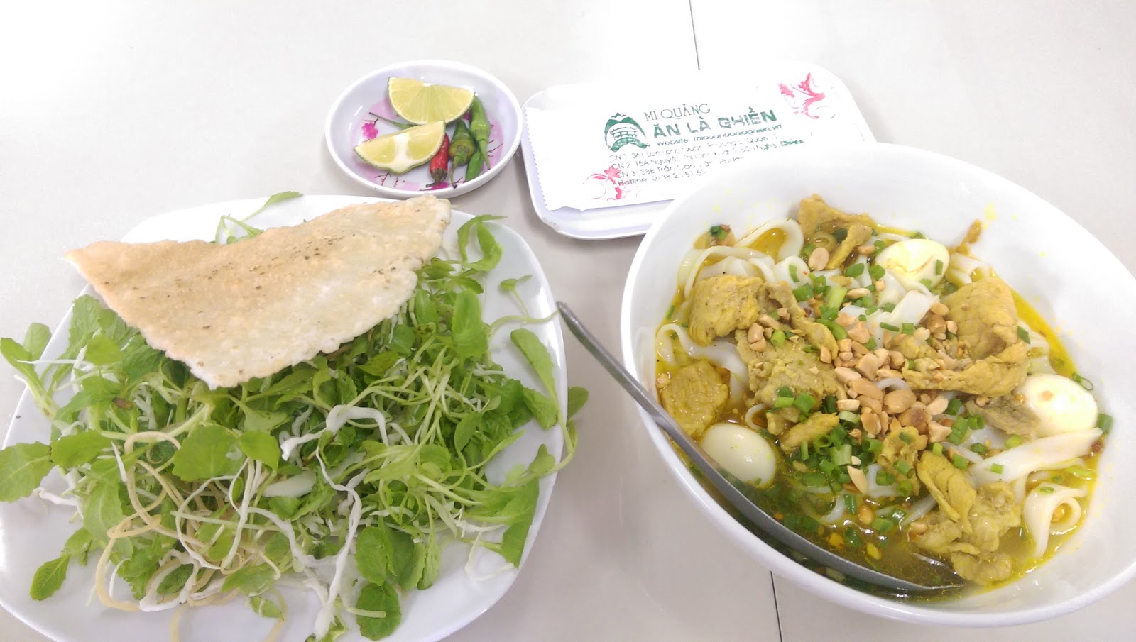 The Ăn Là Ghiền herb plate — baby greens from traced farms (pending the venue photo pass)