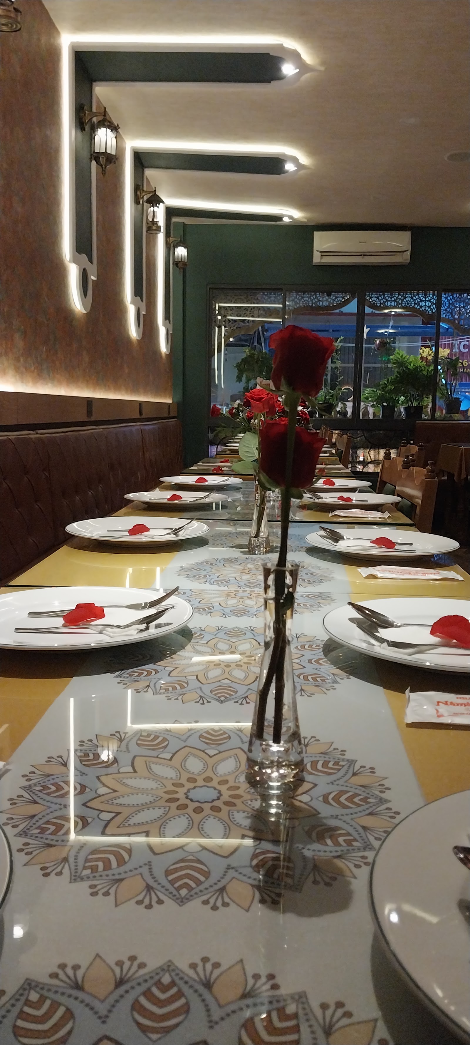 The teal lantern-lit dining room