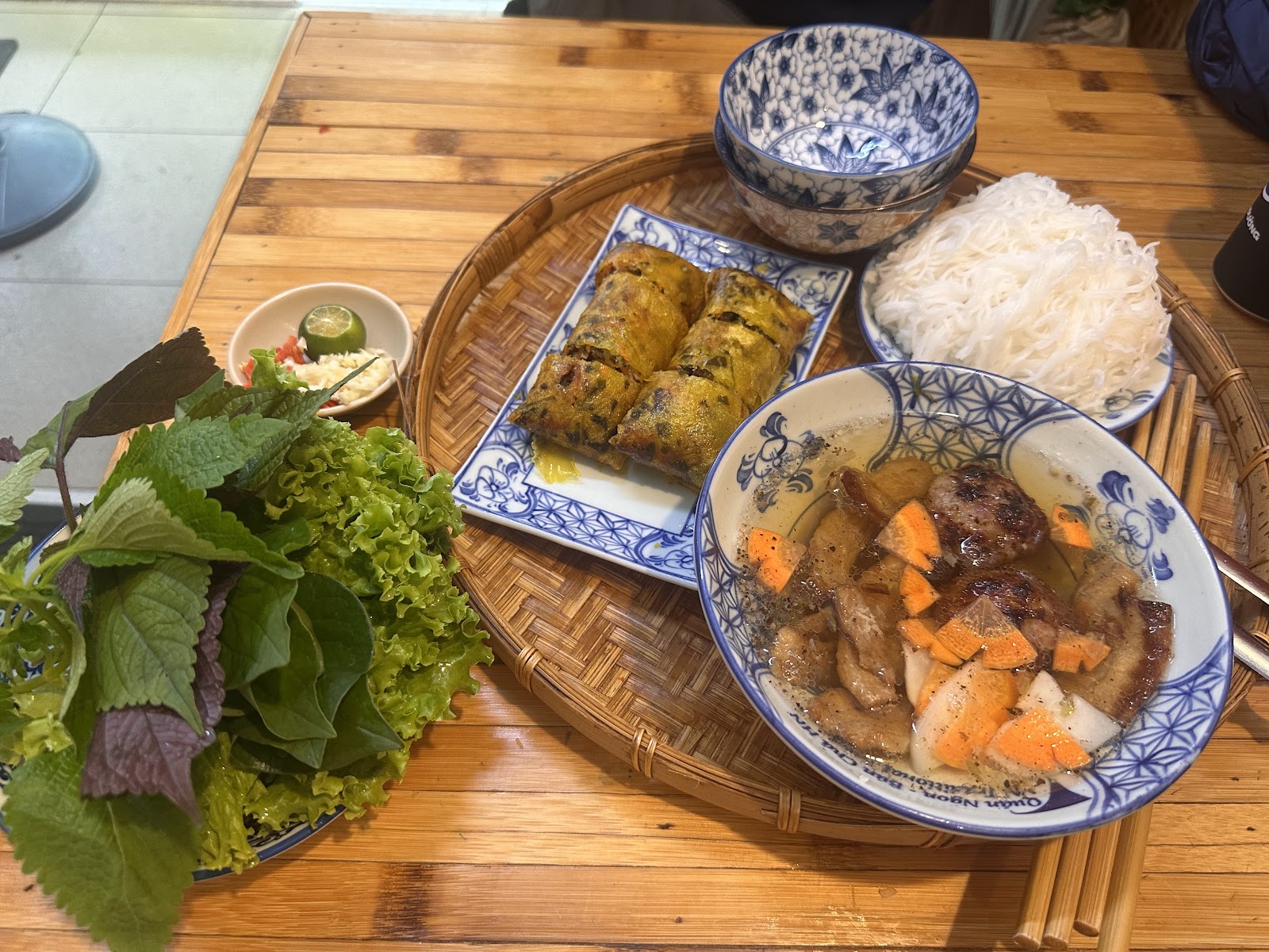 Bún chả with fried rolls — fried rolls cut into pieces served with the platter