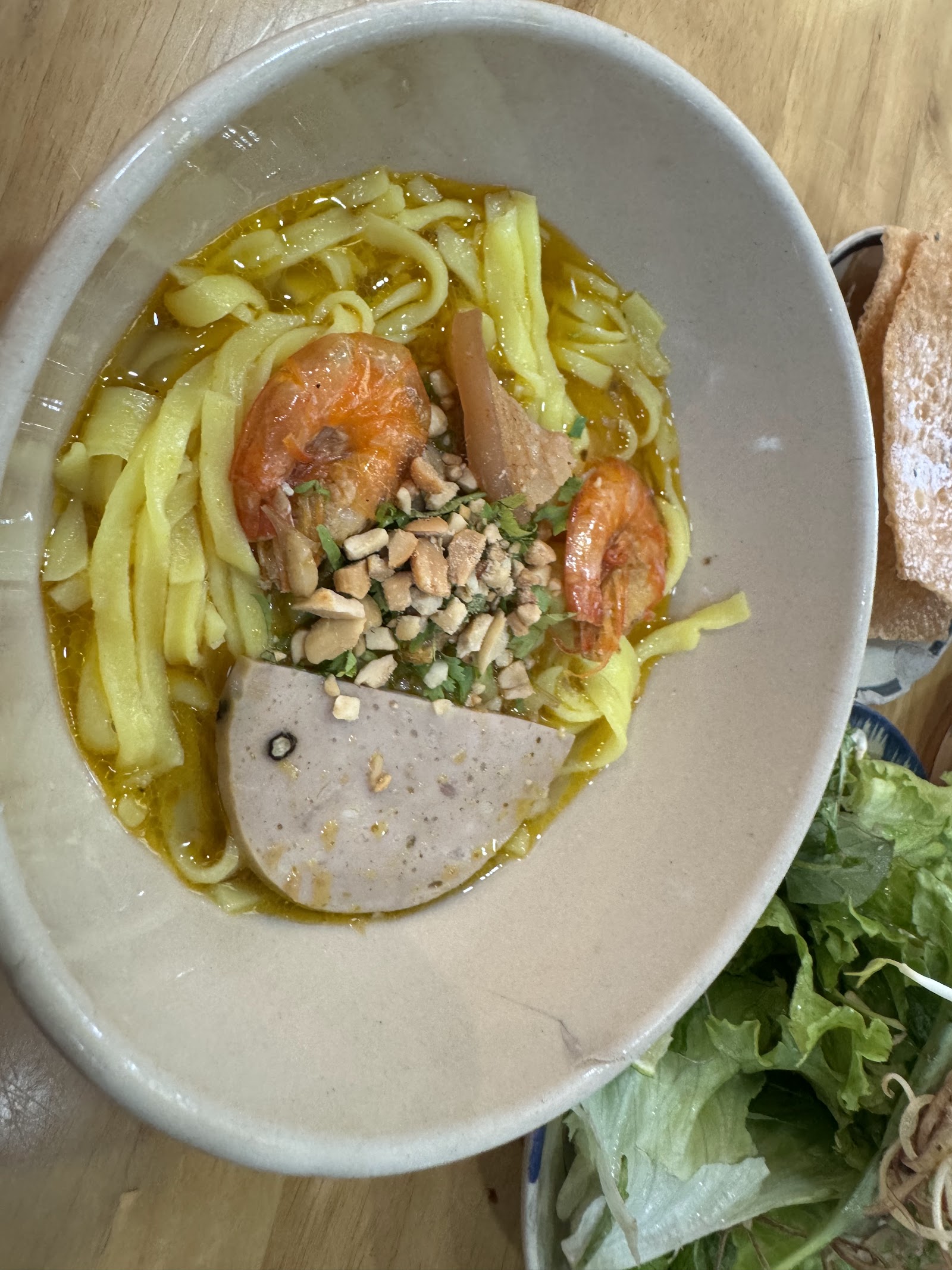 A mì quảng gà bowl at Quán Xóm Chợ Cũ (pending the venue photo pass)