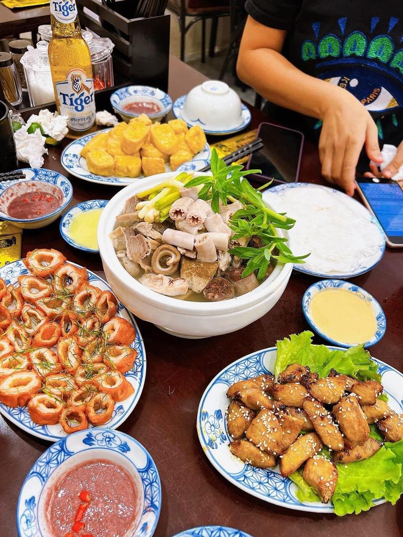 The chao long spread: offal porridge bowl, fried intestine, tofu, dipping sauces