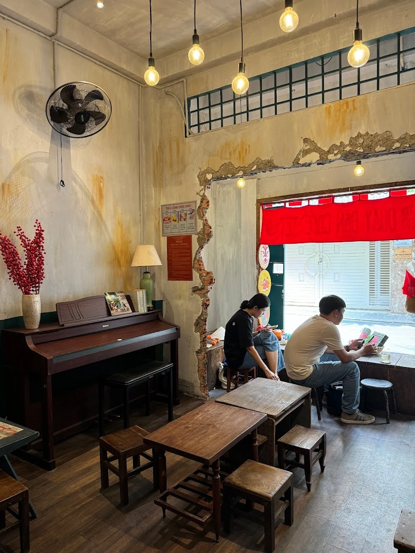 The piano and peeling walls inside the café