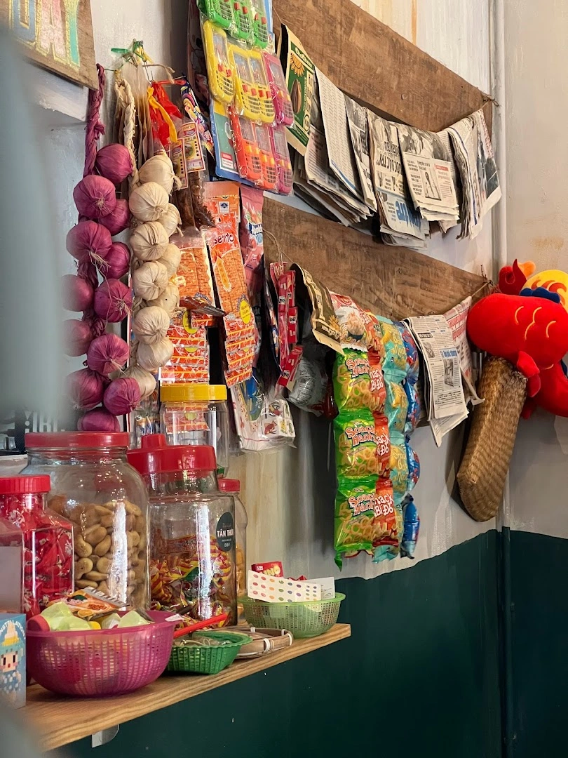 The childhood tạp-hóa corner inside the café