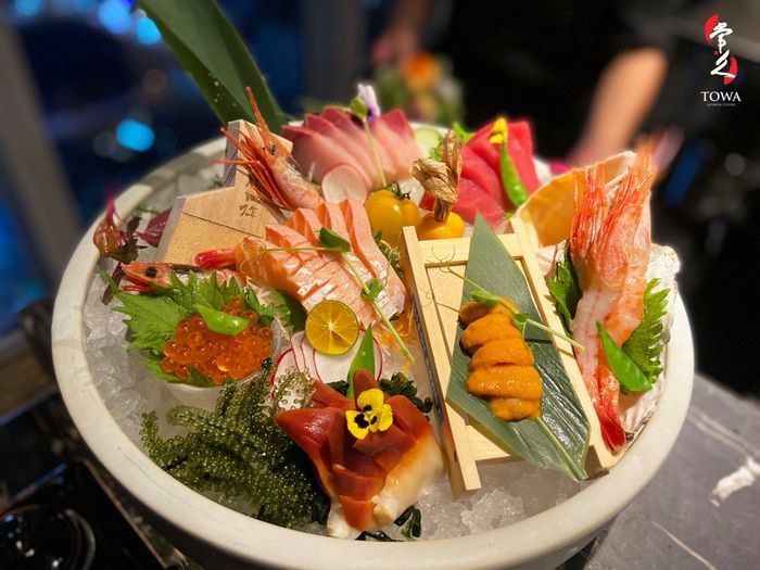 Sashimi boat on ice at night