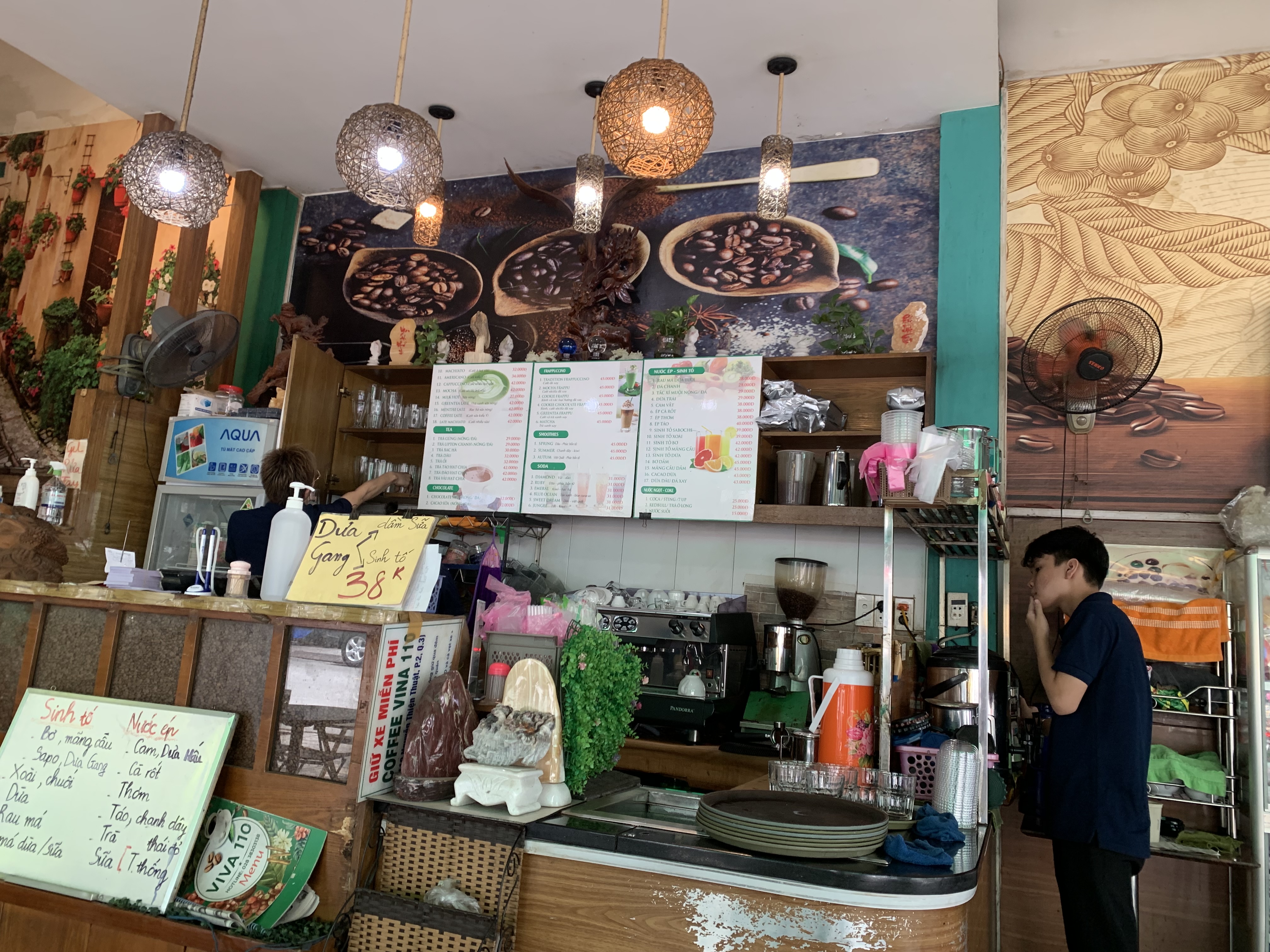 The shop's menu boards above the counter