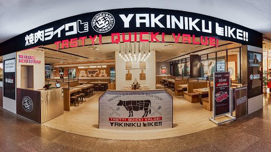 The Yakiniku Like storefront at Vincom Dong Khoi: black fascia, TASTY! QUICK! VALUE! lettering, beef-cut chart